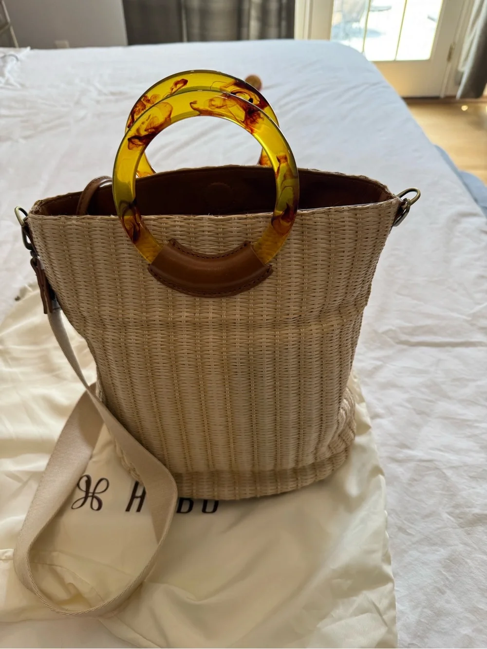 HOBO Straw Bucket Bag with Amber Resin Ring Handles